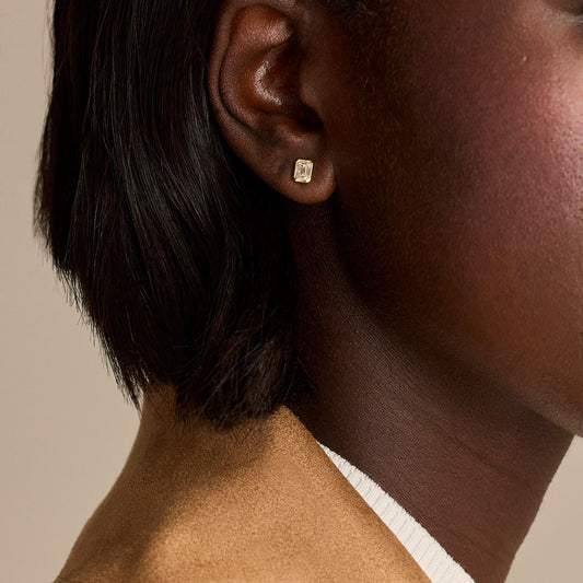 Yellow Gold Emerald Cut Diamond Stud Earrings at DMR