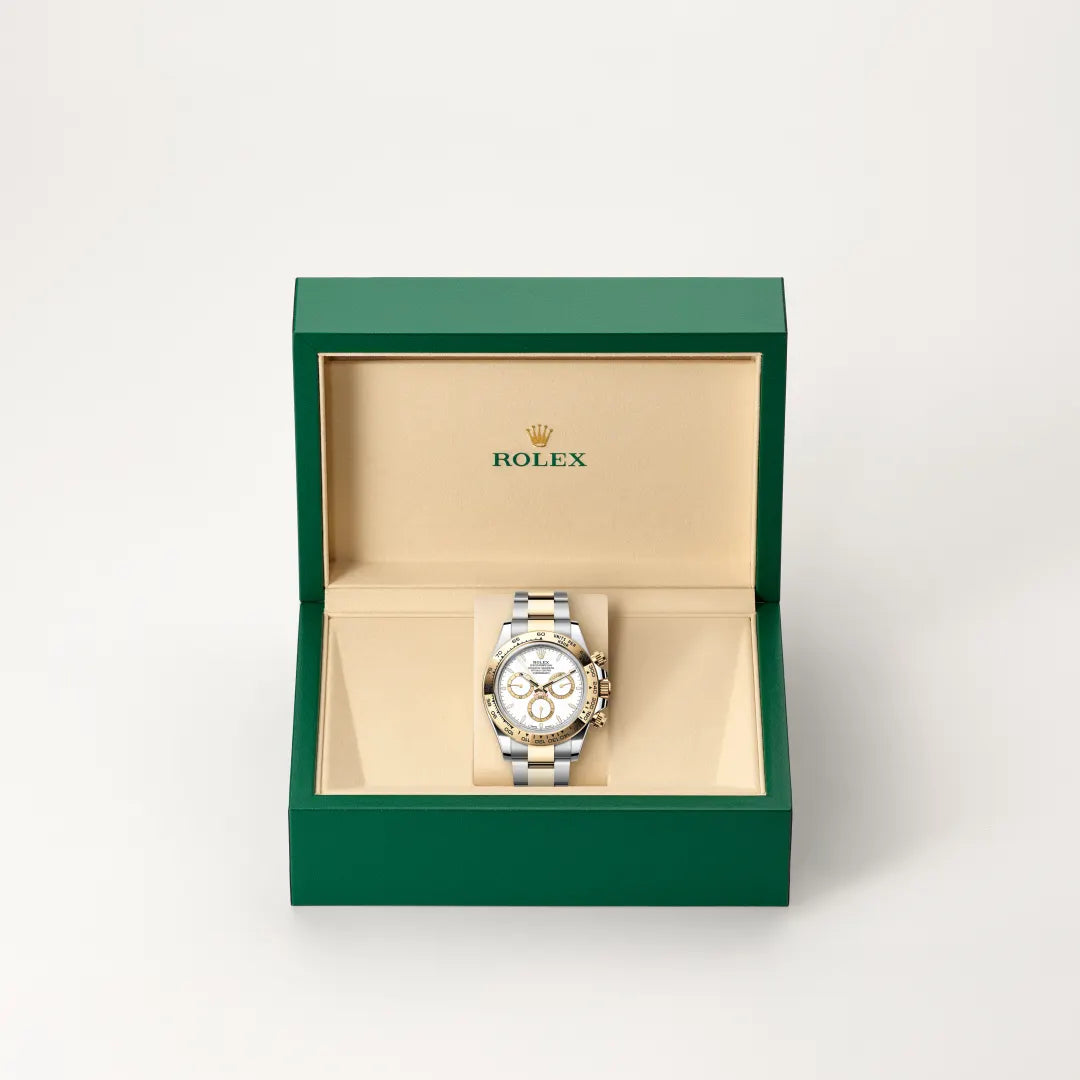 Rolex Cosmograph Daytona in Yellow Rolesor - combination of Oystersteel and yellow gold with a White, golden counter rings dial, Fixed, with engraved tachymetric scale, in yellow gold bezel, Oyster, three-piece solid links bracelet