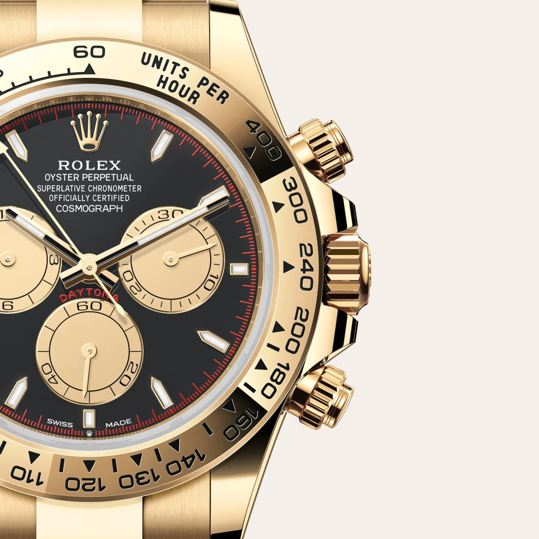 Rolex Cosmograph Daytona in 18 ct yellow gold with a Intense black and champagne-colour dial, Fixed, with engraved tachymetric scale, in 18 ct yellow gold bezel, Oyster, three-piece solid links bracelet