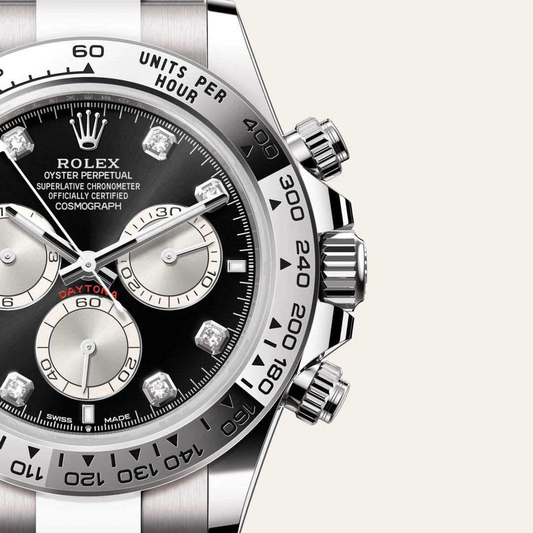 Rolex Cosmograph Daytona in 18 ct white gold with a Bright black and steel set with diamonds dial, Fixed, with engraved tachymetric scale, in 18 ct white gold bezel, Oyster, three-piece solid links bracelet