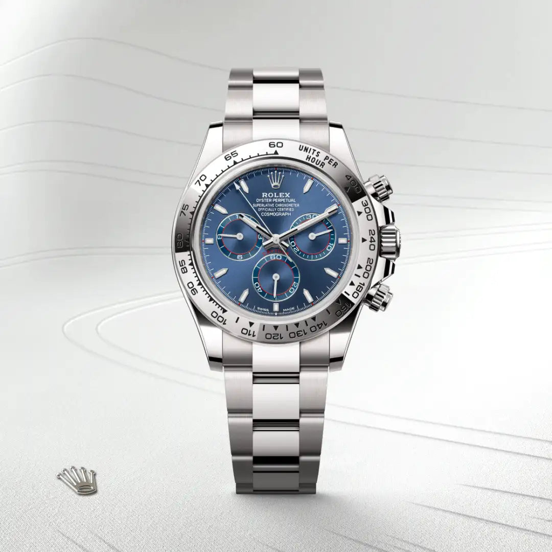 Rolex Cosmograph Daytona in 18 ct white gold with a Bright blue dial, Fixed, with engraved tachymetric scale, in 18 ct white gold bezel, Oyster, three-piece solid links bracelet