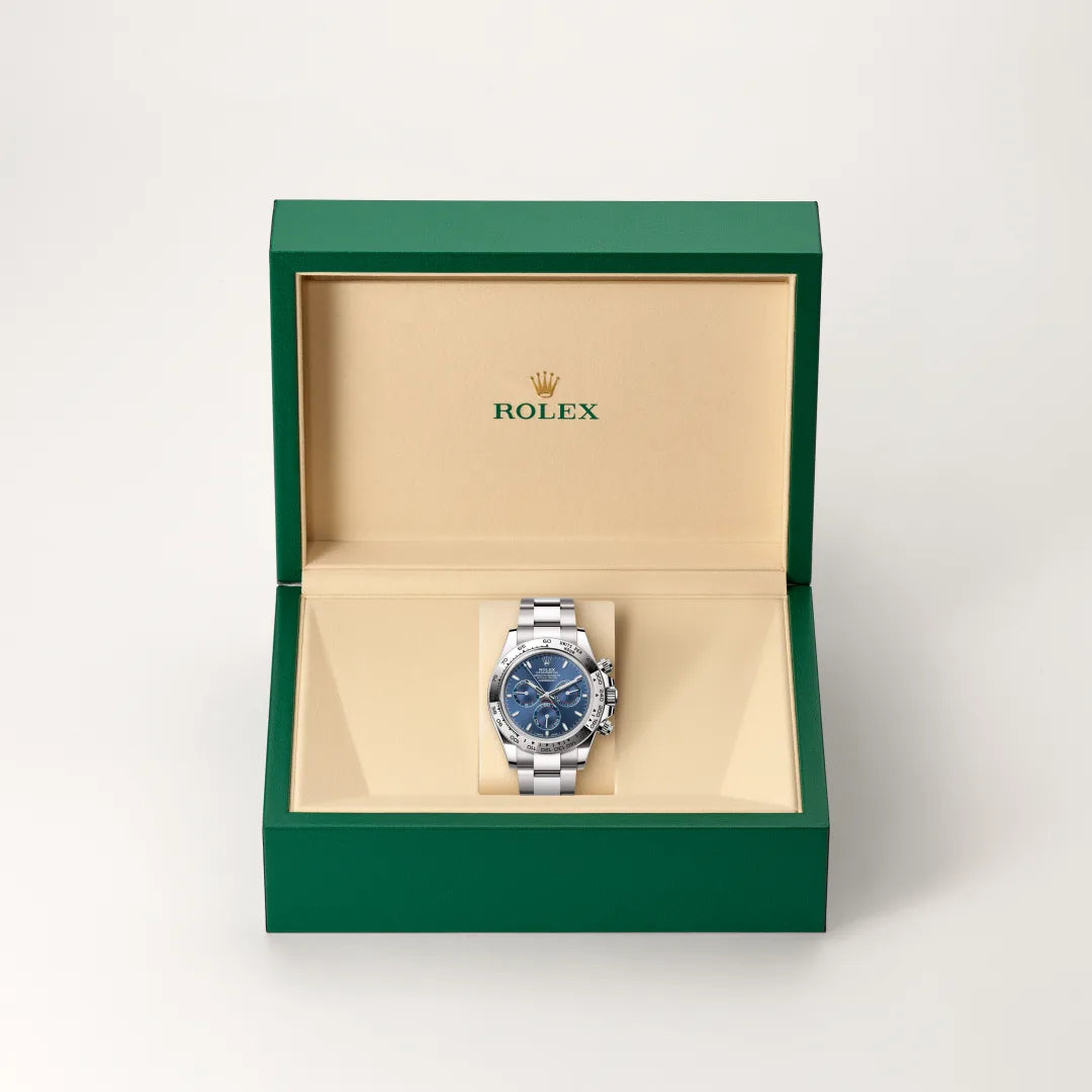 Rolex Cosmograph Daytona in 18 ct white gold with a Bright blue dial, Fixed, with engraved tachymetric scale, in 18 ct white gold bezel, Oyster, three-piece solid links bracelet