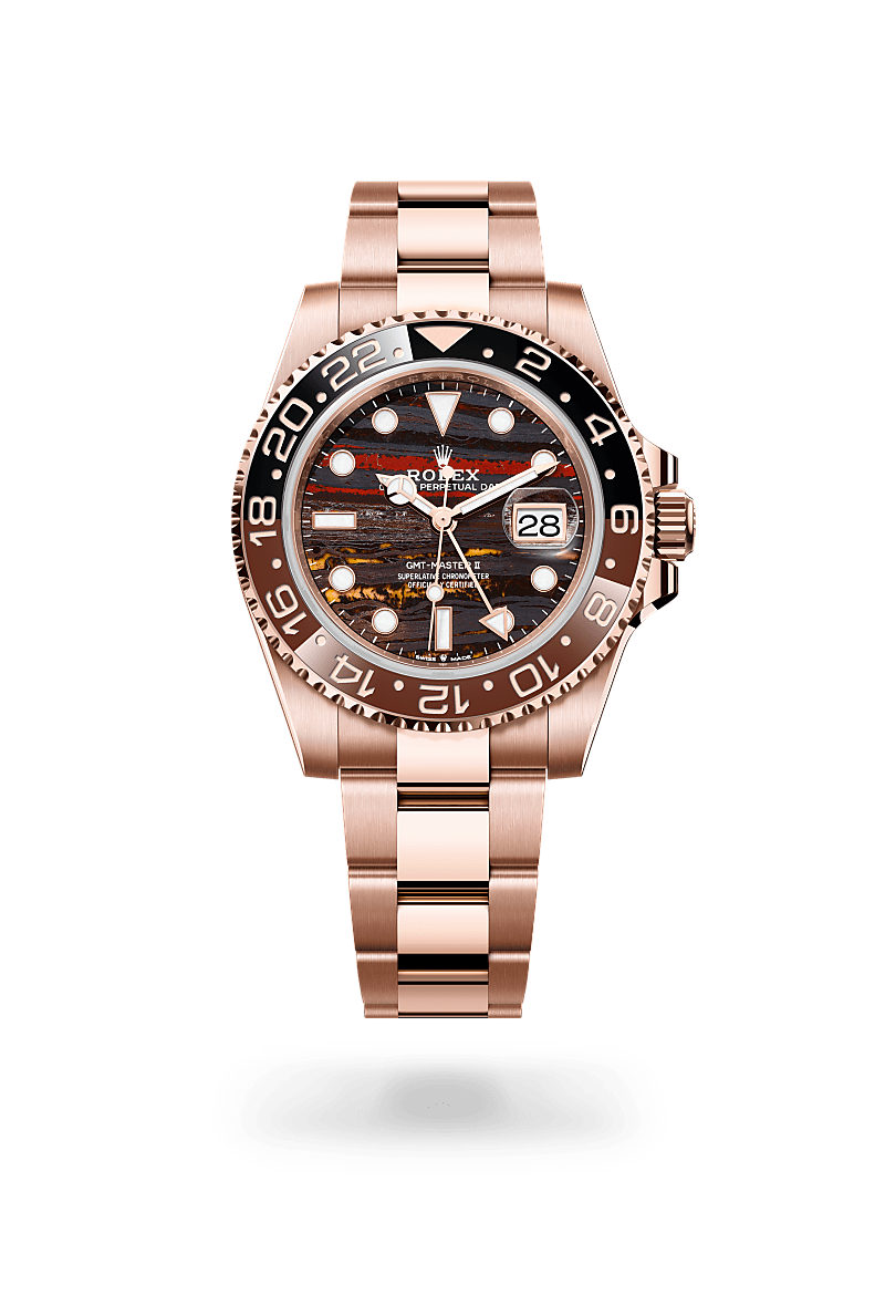 Rolex GMT-Master II in 18 ct Everose gold with a Tiger iron dial, Bidirectional rotatable 24-hour graduated bezel. Two-colour brown and black Cerachrom insert in ceramic, moulded numerals and graduations bezel, Oyster, three-piece solid links bracelet