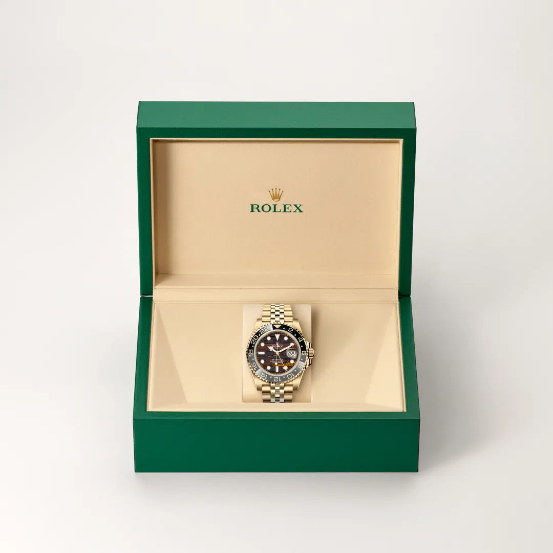 Rolex GMT-Master II in 18 ct yellow gold with a Tiger iron dial, Bidirectional rotatable 24-hour graduated bezel. Two-colour grey and black Cerachrom insert in ceramic, moulded numerals and graduations bezel, Jubilee, five-piece links bracelet