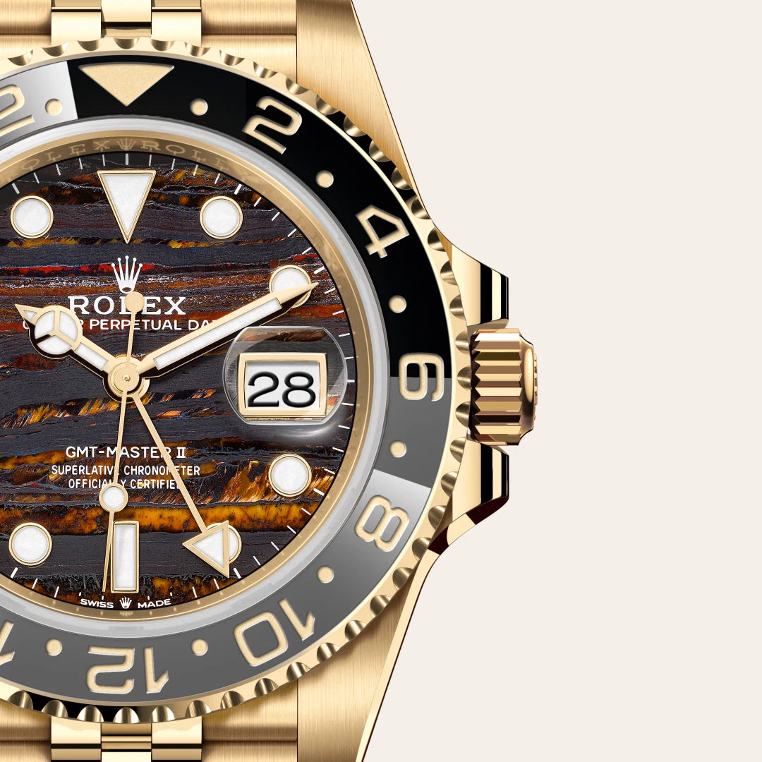 Rolex GMT-Master II in 18 ct yellow gold with a Tiger iron dial, Bidirectional rotatable 24-hour graduated bezel. Two-colour grey and black Cerachrom insert in ceramic, moulded numerals and graduations bezel, Jubilee, five-piece links bracelet