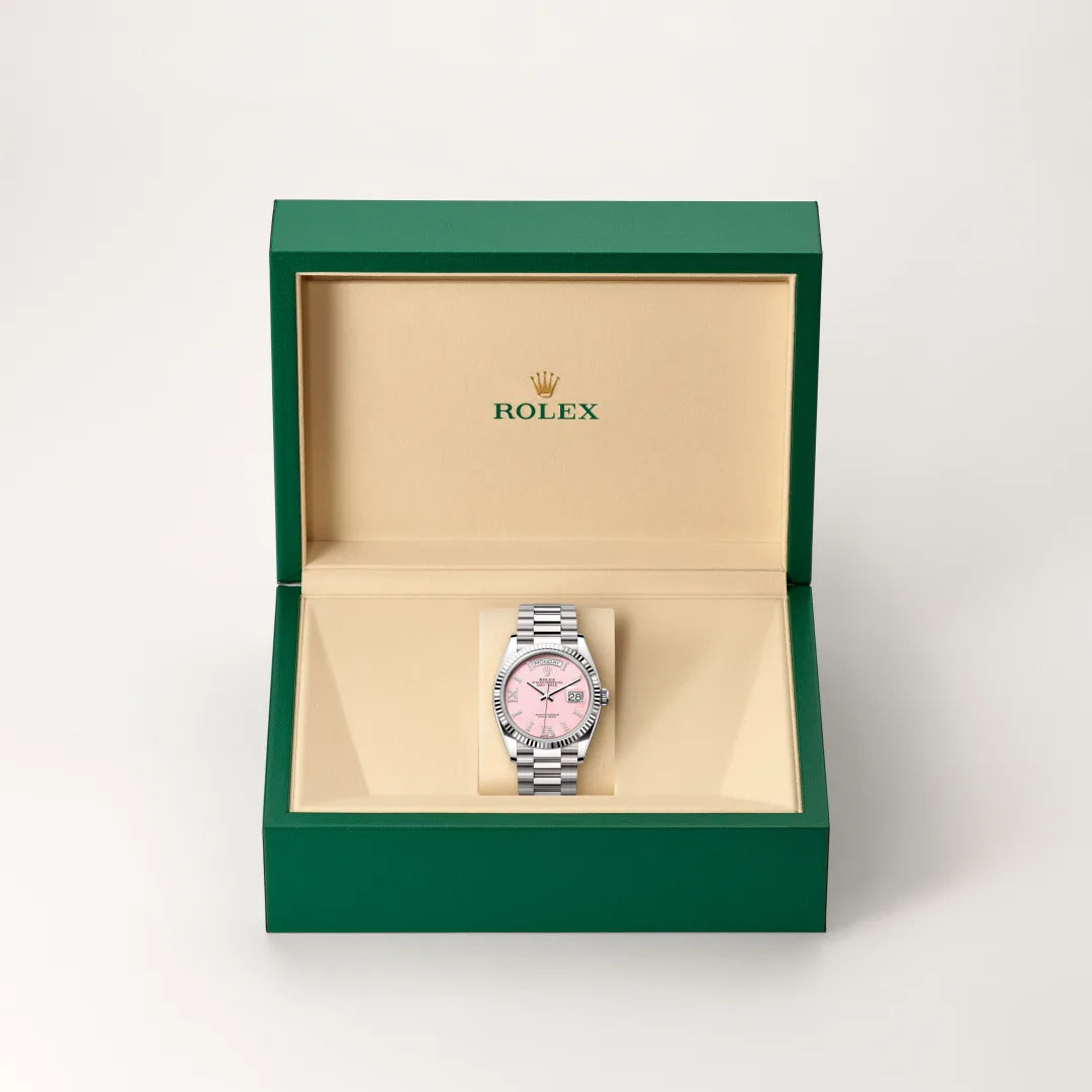 Rolex Day-Date 36 in 18 ct white gold with a Pink opal set with diamonds dial, Fluted bezel, President, semi-circular three-piece links bracelet