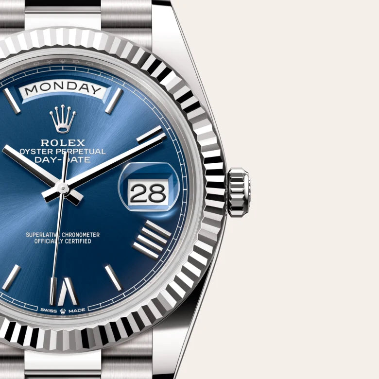Rolex Day-Date 40 in 18 ct white gold with a Bright blue dial, Fluted bezel, President, semi-circular three-piece links bracelet