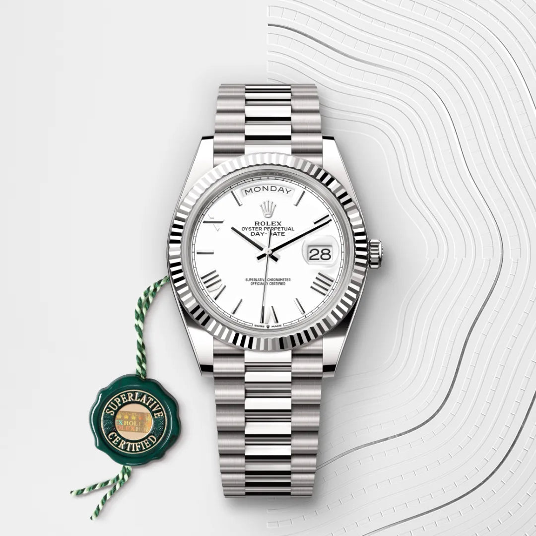 Rolex Day-Date 40 in 18 ct white gold with a White dial, Fluted bezel, President, semi-circular three-piece links bracelet
