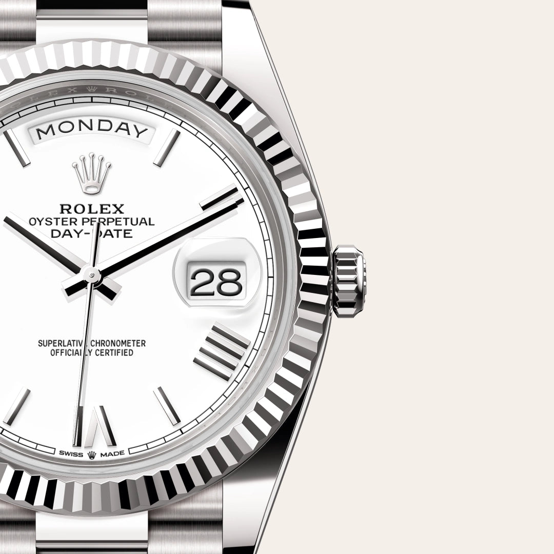 Rolex Day-Date 40 in 18 ct white gold with a White dial, Fluted bezel, President, semi-circular three-piece links bracelet