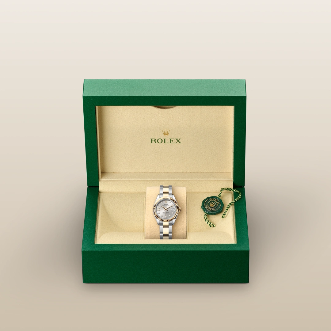 Rolex Lady-Datejust in Yellow Rolesor - combination of Oystersteel and yellow gold with a Silver set with diamonds dial, Fluted bezel, Oyster, three-piece solid links bracelet