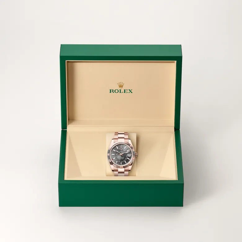 Rolex Sky-Dweller in 18 ct Everose gold with a Slate dial, Fluted, bidirectional rotatable Rolex Ring Command bezel, Oyster, three-piece solid links bracelet