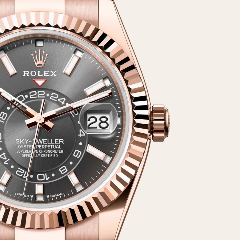 Rolex Sky-Dweller in 18 ct Everose gold with a Slate dial, Fluted, bidirectional rotatable Rolex Ring Command bezel, Oyster, three-piece solid links bracelet