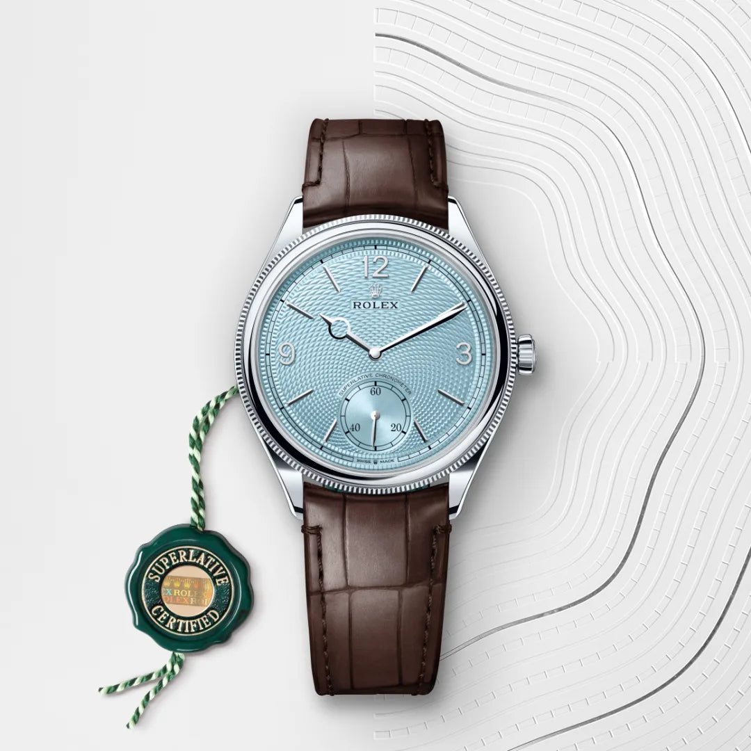 Rolex 1908 in Platinum with a Ice blue, rice-grain motif dial, Domed and fluted bezel, Leather strap bracelet